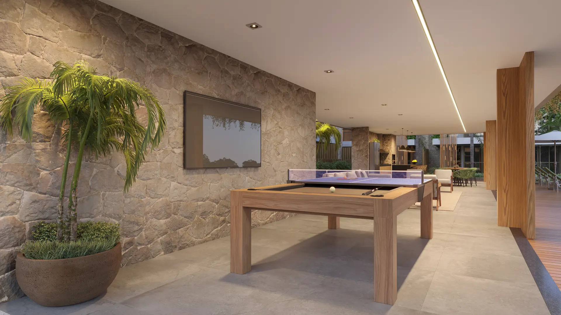 Salão de jogos com mesa de ping-pong e sinuca